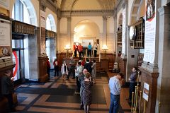 06 White Plaster and Gray Stone Of The Carnegie Hall Foyer Forms a Harmonious System of Round-headed Arched Openings and Corinthian Pilasters New York City.jpg